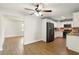 Modern kitchen with white cabinets, stainless steel appliances, and hardwood floors at 1109 Beatrice Dr, Orlando, FL 32810