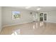 Living room featuring tiled floors, ceiling fan, and access to an enclosed patio at 1109 Beatrice Dr, Orlando, FL 32810