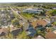 Aerial view of gray home featuring a screened in pool at 12557 Crayford Ave, Orlando, FL 32837