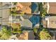 Aerial view of a beautiful home featuring a screened-in pool and well-maintained landscaping at 12557 Crayford Ave, Orlando, FL 32837