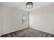 Empty bedroom with neutral carpet, window, and neutral paint at 12557 Crayford Ave, Orlando, FL 32837