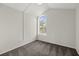 Empty carpeted bedroom with a vaulted window providing ample natural light at 12557 Crayford Ave, Orlando, FL 32837