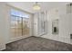 Inviting foyer with grand entrance, large windows, stylish doors, and elegant lighting at 12557 Crayford Ave, Orlando, FL 32837