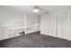 Neutral carpeted loft area overlooks the downstairs with double closet at 12557 Crayford Ave, Orlando, FL 32837