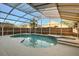 Screened in pool with attached spa and tile accents at 12557 Crayford Ave, Orlando, FL 32837