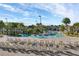 Resort-style pool area with in-pool floaties and lounge chairs for ultimate relaxation and fun at 1312 Shinnecock Hills Dr, Davenport, FL 33896