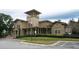 Community clubhouse featuring unique architectural details and well-maintained landscaping at 1321 Arbor Vista Loop # 325, Lake Mary, FL 32746
