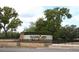 Community entrance with stone sign and mature trees creating a welcoming feel at 1321 Arbor Vista Loop # 325, Lake Mary, FL 32746