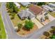 Aerial shot of a well-maintained home, landscaping, and surrounding neighborhood at 1329 Paradise Dr, Lady Lake, FL 32159