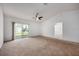 Bedroom with a ceiling fan and a sliding glass door leading to the outside at 1329 Paradise Dr, Lady Lake, FL 32159
