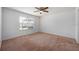 Bedroom featuring a ceiling fan and a window with blinds, perfect for relaxation at 1329 Paradise Dr, Lady Lake, FL 32159