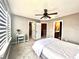 Bedroom with large windows and a ceiling fan at 14533 Orchid Island Dr, Orlando, FL 32827