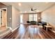 Spacious living room with hardwood floors, neutral walls, and ample natural light at 14533 Orchid Island Dr, Orlando, FL 32827