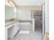 Modern bathroom featuring a tub, walk-in shower, and double vanity sinks at 14711 Winter Stay Dr, Winter Garden, FL 34787