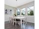 Inviting dining room with a white table, chairs, and modern lighting, great for Gathering gatherings at 14711 Winter Stay Dr, Winter Garden, FL 34787