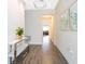 Bright entryway with wood-look tile floors and a decorative console table; art on the wall adds style at 14711 Winter Stay Dr, Winter Garden, FL 34787