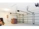 Spacious three-car garage featuring white walls and doors, ready to be customized at 14711 Winter Stay Dr, Winter Garden, FL 34787