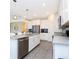 Modern kitchen featuring stainless steel appliances, gray countertops, and stylish cabinetry at 14711 Winter Stay Dr, Winter Garden, FL 34787