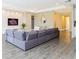 Spacious living room with textured accent wall, recessed lighting, and tile flooring for a clean look at 14711 Winter Stay Dr, Winter Garden, FL 34787