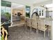This covered patio boasts an outdoor dining set and easy access to the home's interior at 14711 Winter Stay Dr, Winter Garden, FL 34787