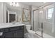 Elegant bathroom featuring a glass-enclosed shower, vanity, and modern fixtures at 16147 Coastal Cove Ln, Clermont, FL 34714