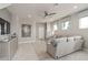 Inviting living room with stylish decor, tile floors, and plenty of natural light at 16147 Coastal Cove Ln, Clermont, FL 34714