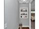 Entryway niche with custom display shelving and decorative items, adjacent to a bedroom at 1819 Sw 29Th St, Ocala, FL 34471