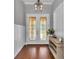 Welcoming foyer featuring beautiful hardwood floors, elegant lighting, and a glimpse of the stylishly decorated interior at 1819 Sw 29Th St, Ocala, FL 34471