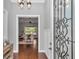 Bright foyer leading to the living room with hardwood floors and a view of the comfortable living area at 1819 Sw 29Th St, Ocala, FL 34471