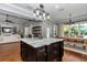 Open-concept kitchen with a spacious island, dining area, and seamless flow to the living space at 1819 Sw 29Th St, Ocala, FL 34471