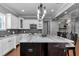 Bright kitchen showcasing a large island with seating and modern appliances, perfect for entertaining at 1819 Sw 29Th St, Ocala, FL 34471