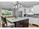 Beautiful kitchen with a large center island, stainless steel appliances, and a view to the dining area at 1819 Sw 29Th St, Ocala, FL 34471