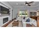 Spacious living room with hardwood floors and a cozy fireplace at 1819 Sw 29Th St, Ocala, FL 34471