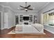 Living room featuring entertainment center, couch, and large windows at 1819 Sw 29Th St, Ocala, FL 34471