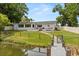 Spacious backyard featuring a waterfront view and a deck that is perfect for outdoor enjoyment at 201 Cedarwood Dr, Maitland, FL 32751