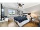 Comfortable bedroom with cozy bedding, ample natural light, and stylish decor at 201 Cedarwood Dr, Maitland, FL 32751