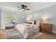 Bright bedroom with natural light, stylish rug, and warm decor at 201 Cedarwood Dr, Maitland, FL 32751