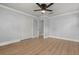 Bedroom with ceiling fan, closets, and doorways leading to other rooms at 201 Cedarwood Dr, Maitland, FL 32751
