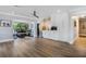 Dining area with modern lighting fixtures, a wine cooler, coffee machine and views of the greenery outside at 201 Cedarwood Dr, Maitland, FL 32751