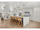 Spacious kitchen with a large island, pendant lights, stainless steel appliances, and an open layout to the living room at 201 Cedarwood Dr, Maitland, FL 32751
