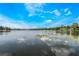 Scenic lake view showcasing peaceful waters and lush shoreline, perfect for waterfront enjoyment at 201 Cedarwood Dr, Maitland, FL 32751