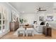 Stylish living room with hardwood floors, modern furniture, and a seamless flow to the open kitchen at 201 Cedarwood Dr, Maitland, FL 32751
