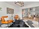 Stylish living room with unique decor and views into the open-concept dining and kitchen areas at 201 Cedarwood Dr, Maitland, FL 32751