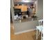 Galley kitchen with bar seating, modern appliances, wood cabinets and granite countertops at 2053 #E Dixie Belle Dr # E, Orlando, FL 32812