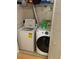Functional laundry room equipped with a washing machine and dryer, ensuring convenience at 2053 #E Dixie Belle Dr # E, Orlando, FL 32812