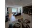 Inviting combined living and dining area featuring stylish furnishings and warm, natural lighting at 2053 #E Dixie Belle Dr # E, Orlando, FL 32812