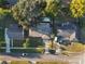 Drone eye view showcasing property nestled among surrounding homes and lush greenery at 2070 Keyes Ln, Deltona, FL 32738