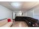 Spacious basement with hardwood floors, a brown sectional couch, and lots of room at 2070 Keyes Ln, Deltona, FL 32738