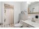 Bathroom with shower, toilet, sink, and a large mirror with decor at 2070 Keyes Ln, Deltona, FL 32738