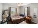 This bedroom contains hardwood floors and two windows for ample natural lighting at 2070 Keyes Ln, Deltona, FL 32738